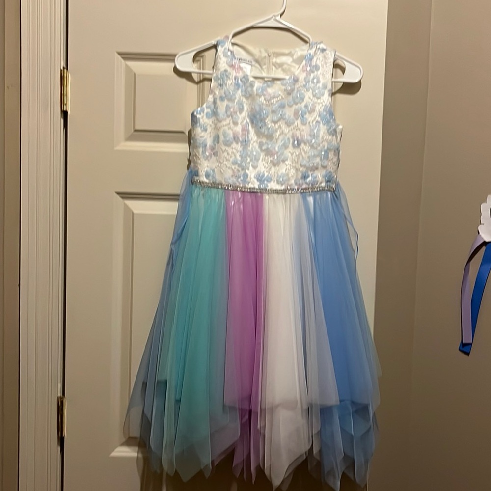 Youth girls dress size 12. Multicolored tulle bottom with flower detailed top.